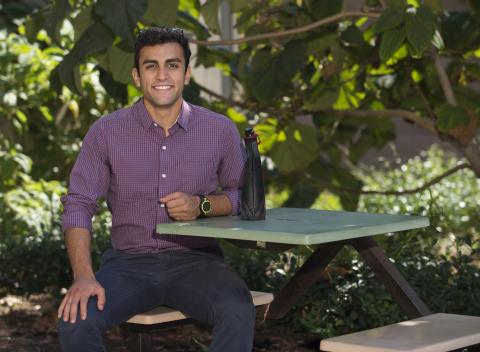 Graduate student sitting at picnic table