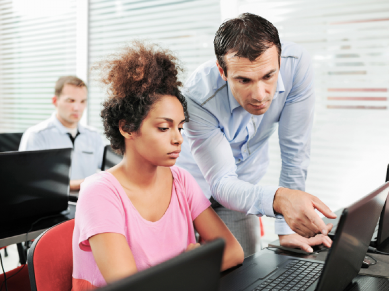 teacher helping student